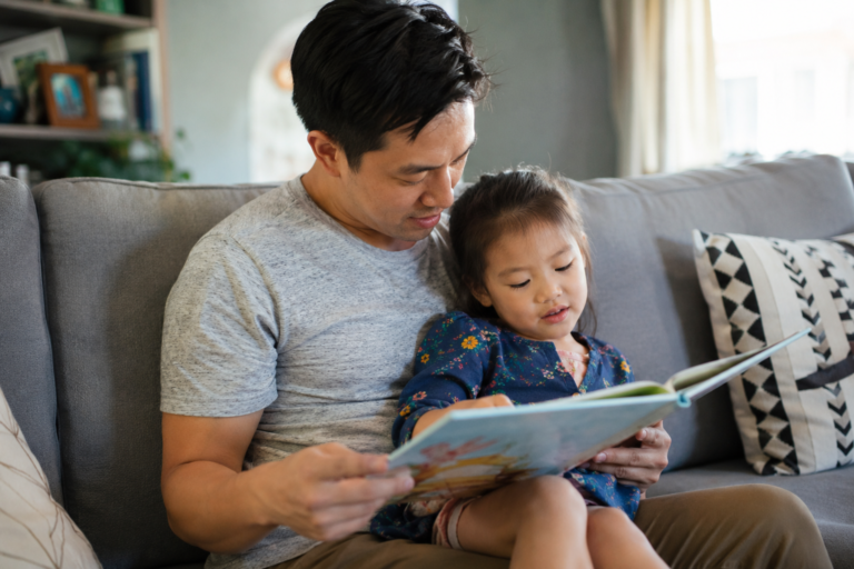 parent reading with child while waiting for speech therapy support