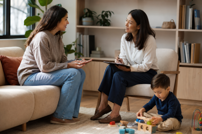 Parent discussing tongue tie treatment and speech therapy options with a professional